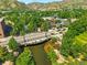 Expansive aerial view of the town, showcasing a bridge over a river and lush surroundings at 409 Lookout View Dr, Golden, CO 80401