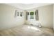 Bright bedroom with two windows and neutral carpeting, ready for your personal touch at 409 Lookout View Dr, Golden, CO 80401