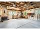 Spacious two car garage featuring exposed wood beams and ample lighting and workspace at 409 Lookout View Dr, Golden, CO 80401