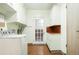 Bright laundry room with white cabinets, copper countertops, and vintage-style washing machine at 409 Lookout View Dr, Golden, CO 80401