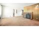 Spacious living room with pink carpet, white walls, a brick fireplace and a doorway leading to other rooms at 409 Lookout View Dr, Golden, CO 80401