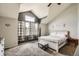Bright bedroom with vaulted ceilings, three large windows, carpet, and a large bed at 12013 W 56Th Cir, Arvada, CO 80002