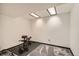 Finished workout area with recessed lights, black rubber flooring, and carpet at 12013 W 56Th Cir, Arvada, CO 80002