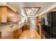 Well-appointed kitchen with stylish cabinetry, granite countertops, and modern appliances at 12013 W 56Th Cir, Arvada, CO 80002