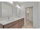 Bathroom featuring double sinks and a walk in closet at 1231 Newton St, Denver, CO 80204