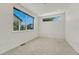 Empty carpeted bedroom with two modern windows and lots of light at 1231 Newton St, Denver, CO 80204
