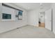 Well lit bedroom featuring neutral walls, carpeted floors and a large window at 1231 Newton St, Denver, CO 80204
