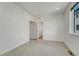 Spacious bedroom showcasing neutral carpet, white walls, recessed lighting, and an open doorway at 1231 Newton St, Denver, CO 80204