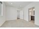 Spacious bedroom featuring neutral walls, carpeted floors and multiple doors at 1231 Newton St, Denver, CO 80204