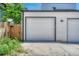 Exterior view of the garage, showcasing its modern design and access to the driveway and yard at 1231 Newton St, Denver, CO 80204