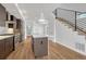 Bright kitchen featuring stainless steel appliances, white countertops, and a functional center island at 1231 Newton St, Denver, CO 80204