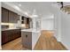 Modern kitchen boasts stainless appliances, sleek countertops, and stylish island with pendant lighting at 1231 Newton St, Denver, CO 80204