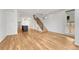 Open floor plan with hardwood floors, modern staircase, and seamless transition to the kitchen at 1231 Newton St, Denver, CO 80204