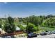 Beautiful neighborhood view featuring mature trees, blue skies, and nearby homes at 1231 Newton St, Denver, CO 80204
