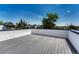 Expansive roof deck, perfect for outdoor entertaining with its sleek gray decking and neighborhood views at 1231 Newton St, Denver, CO 80204