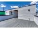 Modern roof deck with gray decking, offering a stylish outdoor living space and sleek architectural design at 1231 Newton St, Denver, CO 80204