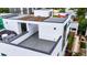 Modern rooftop deck with stylish outdoor furniture and panoramic views at 1231 Newton St, Denver, CO 80204