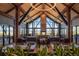 Stunning dining room with stone fireplace and a wall of windows revealing gorgeous mountain views at 724 Evening Star Dr, Castle Rock, CO 80108