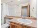 Clean bathroom with a white sink and white shower curtain at 22263 E Euclid Dr, Aurora, CO 80016