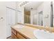 Double vanity bathroom with shower and linen closet at 22263 E Euclid Dr, Aurora, CO 80016