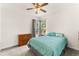 Bright bedroom with a teal comforter and dresser at 22263 E Euclid Dr, Aurora, CO 80016