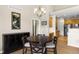 Dining area with a round table and chairs, looking toward the kitchen at 22263 E Euclid Dr, Aurora, CO 80016