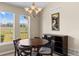 Bright dining room with a view of the backyard and golf course at 22263 E Euclid Dr, Aurora, CO 80016