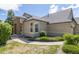 Exterior view of a charming ranch home with stone accents at 22263 E Euclid Dr, Aurora, CO 80016