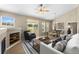 Bright living room with vaulted ceiling, fireplace, and access to backyard patio at 22263 E Euclid Dr, Aurora, CO 80016