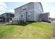 Spacious backyard featuring a lush green lawn, a deck, and a fence providing privacy and charm at 4955 Trails Edge Ln, Castle Rock, CO 80104