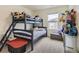 Cozy bedroom featuring a bunk bed, a window offering natural light, and playful stuffed animal decorations at 4955 Trails Edge Ln, Castle Rock, CO 80104