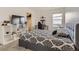 Bedroom with a black and white patterned bed, desk, and closet space at 4955 Trails Edge Ln, Castle Rock, CO 80104