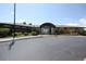 Front exterior of the Crystal Valley clubhouse featuring an arched entrance and manicured landscaping at 4955 Trails Edge Ln, Castle Rock, CO 80104
