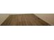 Close-up view of wood-look laminate flooring, showcasing the texture and color variations at 4955 Trails Edge Ln, Castle Rock, CO 80104