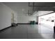Spacious two-car garage featuring sealed concrete flooring, storage space, and ample lighting at 4955 Trails Edge Ln, Castle Rock, CO 80104