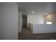 Upstairs hallway space with neutral carpet, creating a seamless transition between rooms at 4955 Trails Edge Ln, Castle Rock, CO 80104