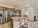 Eat-in kitchen with granite countertops, stainless appliances, and bar seating at 4955 Trails Edge Ln, Castle Rock, CO 80104