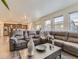 Spacious living room with a comfortable sofa and an open view into kitchen at 4955 Trails Edge Ln, Castle Rock, CO 80104