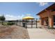 Community pool area showcasing the pool, fencing, lounge chairs, and surrounding landscaping at 4955 Trails Edge Ln, Castle Rock, CO 80104