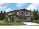 Charming two-story home with covered porch, neutral siding, well manicured lawn, and an attached two-car garage at 8338 Snake River St, Littleton, CO 80125