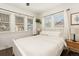 Bright bedroom with a queen bed and plenty of natural light at 1629 Trenton St, Denver, CO 80220