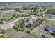 Aerial view of home featuring large lot, circle driveway, mature landscaping and other homes nearby at 36921 Ruger Ct, Elizabeth, CO 80107