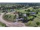 Expansive aerial view of property with well maintained lawns, mature trees, and horse property at 36921 Ruger Ct, Elizabeth, CO 80107