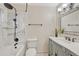 Bathroom with a marble shower, modern fixtures, and vanity with stylish mirror at 36921 Ruger Ct, Elizabeth, CO 80107