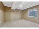Carpeted bedroom featuring a window and neutral color scheme at 36921 Ruger Ct, Elizabeth, CO 80107