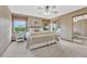 Bedroom featuring a ceiling fan, carpet, and large windows with lots of light at 36921 Ruger Ct, Elizabeth, CO 80107