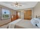 Comfortable bedroom with a ceiling fan, closet, and lots of natural light from windows at 36921 Ruger Ct, Elizabeth, CO 80107