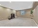 Spacious carpeted bedroom with a window and built-in shelving and ample natural light at 36921 Ruger Ct, Elizabeth, CO 80107