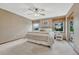 Bedroom featuring a ceiling fan, carpet, and large windows with natural light at 36921 Ruger Ct, Elizabeth, CO 80107