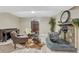 Cozy living room with wood-burning stove, piano, and decorative screen at 36921 Ruger Ct, Elizabeth, CO 80107